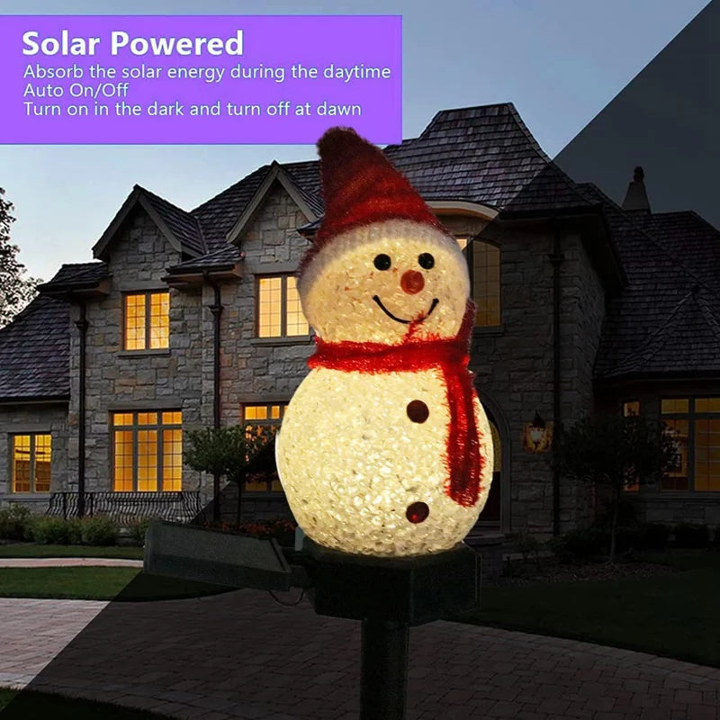 Muñeco de nieve solar con encendido automático en la entrada de casa